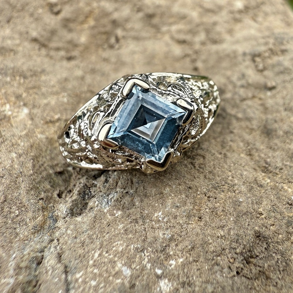 Vintage 14 Karat White Gold and Blue Topaz Ring with Intricate Design